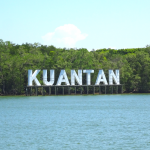 Kuantan sign on riverbank