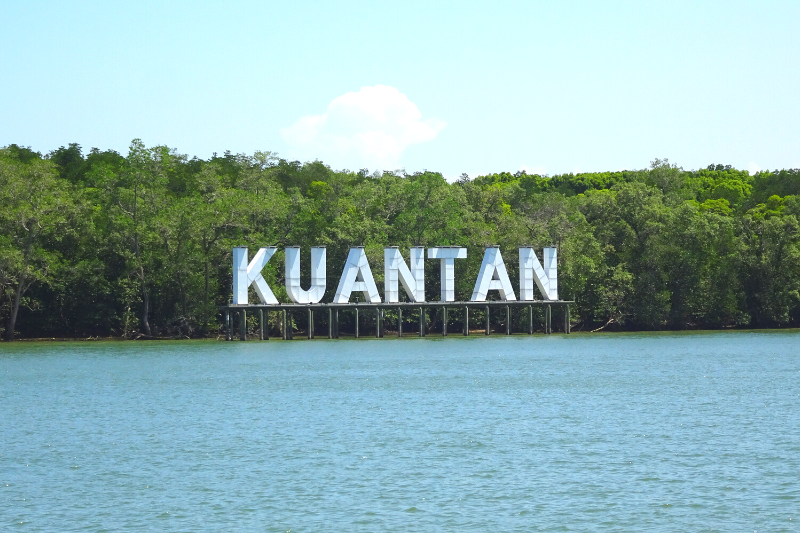 Kuantan sign on riverbank