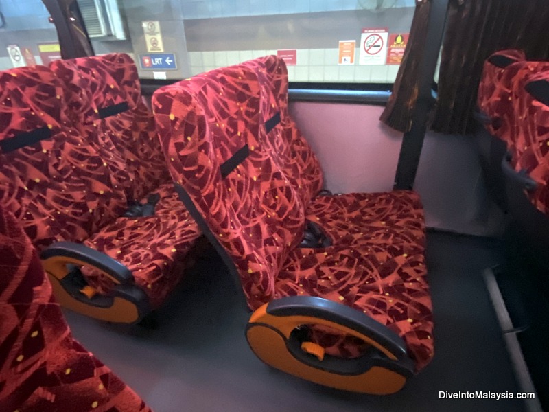 Seats inside the bus. It's quite comfortable with USB charger