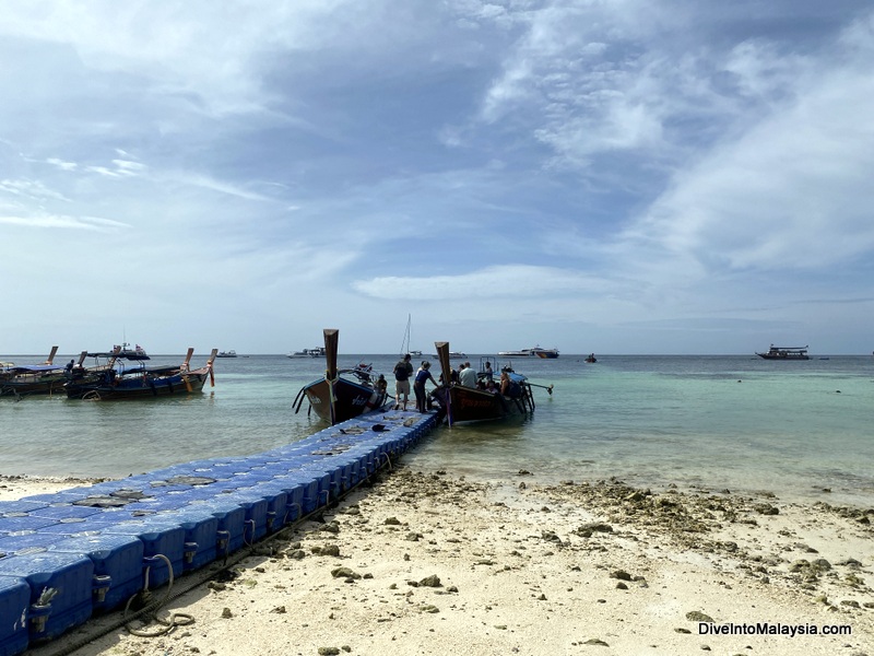 Getting on the longtails to go to the ferry to Langkawi