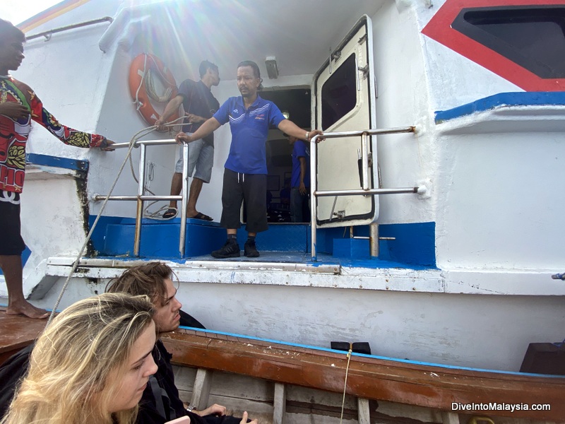 Hopping on the Langkawi ferry from the longtail boat from Koh Lipe